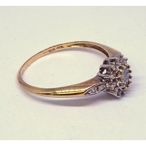 367 - A cluster ring, yellow metal marked 9ct set with blue and white stones.  Head 9.5 x 8mm oval.