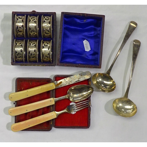 415 - A pair of silver sauce ladles, 19th cent, 87gr; a cased set of 6 numbered napkin rings, EPNS; a case... 