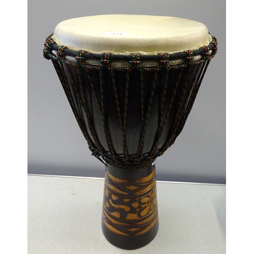371 - A large drum and case, 60cm high.