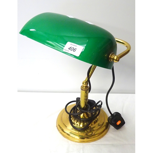 406 - A brass desk lamp. small chip to shade.