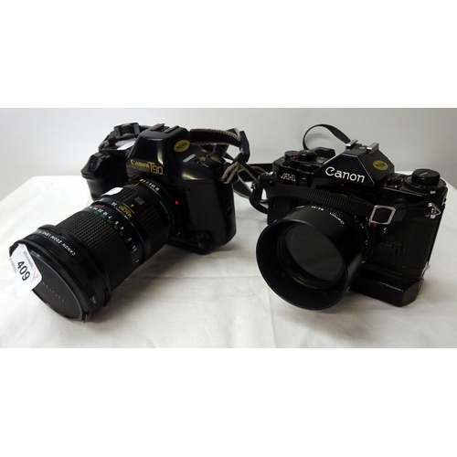 409 - Two Canon cameras with lenses.