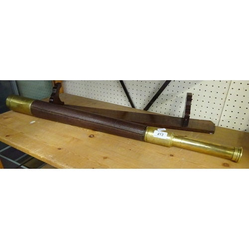 413 - A Kelvin White and Hutton London brass and leather telescope.