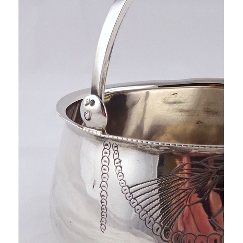 11 - A Russian white metal swing handle bowl on three ball feet, 98mm diameter; a Russian white metal fid... 