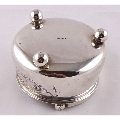 11 - A Russian white metal swing handle bowl on three ball feet, 98mm diameter; a Russian white metal fid... 