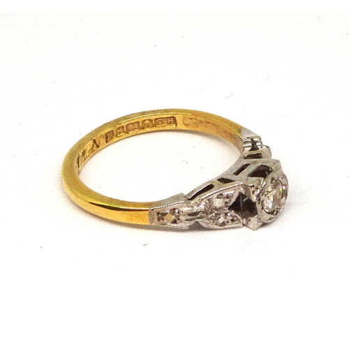 102 - A ring comprising a single brilliant cut white stone set in a circular setting within a square shape... 