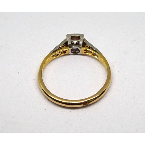 104 - A ring comprising a single brilliant cut white stone set in a square setting with stone set shoulder... 