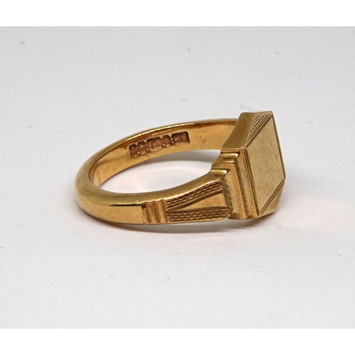 120 - A 9ct gold signet ring having stepped shoulders and engine turned decoration.  6gr / size O 1/2 (by ... 