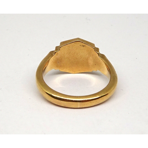 120 - A 9ct gold signet ring having stepped shoulders and engine turned decoration.  6gr / size O 1/2 (by ... 