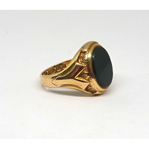 122 - A signet ring comprising a polished onyx stone in an oval 15ct gold carved setting, stone rubbed.  1... 