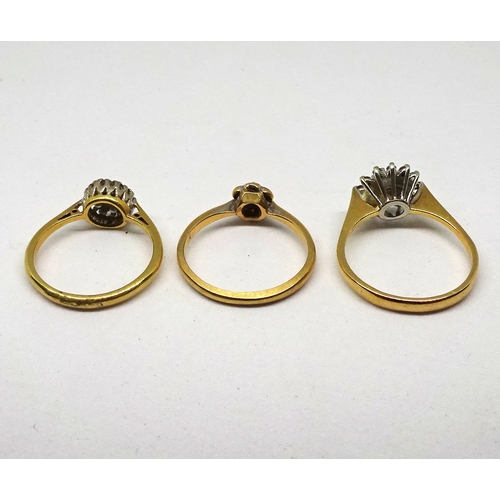 129 - Three cluster rings, yellow and white metal marked 18ct set with small brilliant cut white stones. (... 