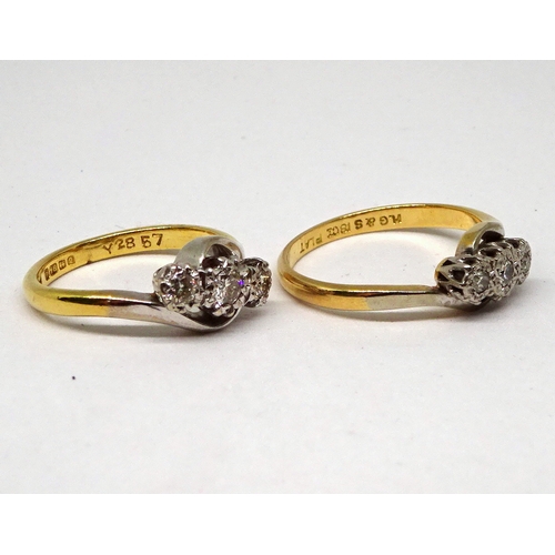 137 - Two trilogy twist rings, one 18ct gold & platinum, one yellow metal marked 18ct & Plat, both set wit... 