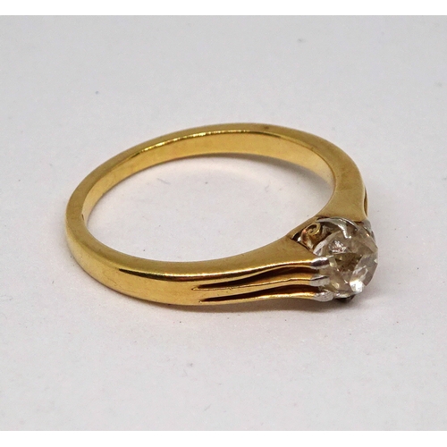 139 - A solitaire ring comprising an old cut white stone in a claw setting, yellow metal marked 18ct.  Siz... 