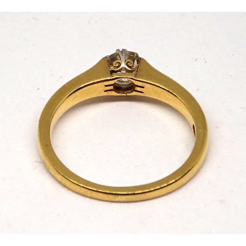 139 - A solitaire ring comprising an old cut white stone in a claw setting, yellow metal marked 18ct.  Siz... 