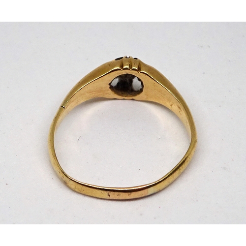 144 - A gentleman's solitaire ring comprising a brilliant cut white stone in a claw setting, yellow metal ... 