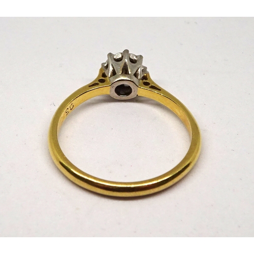 145 - A solitaire ring comprising a brilliant cut white stone in an enclosed claw setting, yellow and whit... 