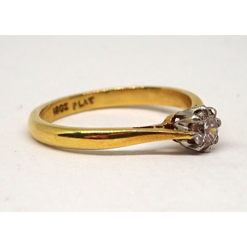 147 - A solitaire ring, comprising a brilliant cut white stone in a white metal claw setting, yellow metal... 