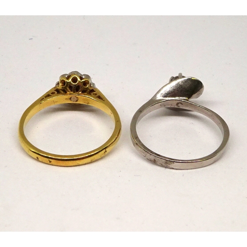 167 - A solitaire ring comprising a brilliant cut white stone in a raised claw setting within twist should... 