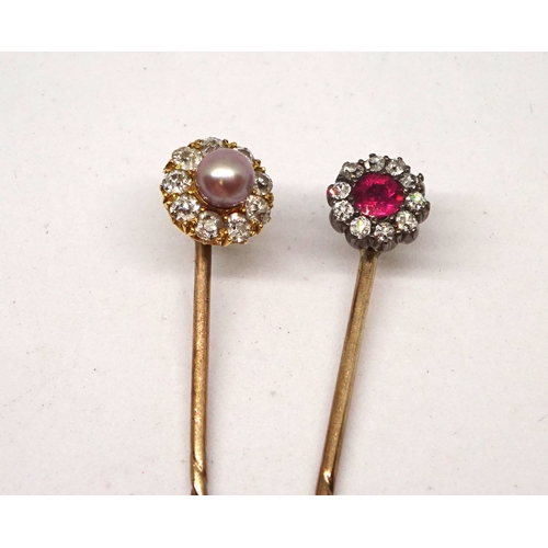 175 - A stick pin having a cluster head comprising ten old cut white stones around a central red stone, he... 