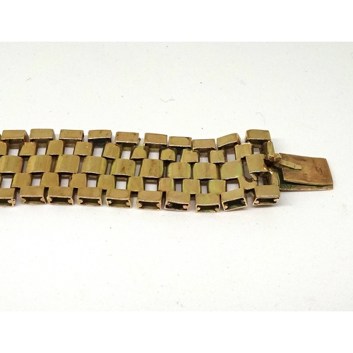 82 - A ribbon bracelet of box link design arranged in a geometric pattern, yellow metal marked 9ct, a/f. ... 