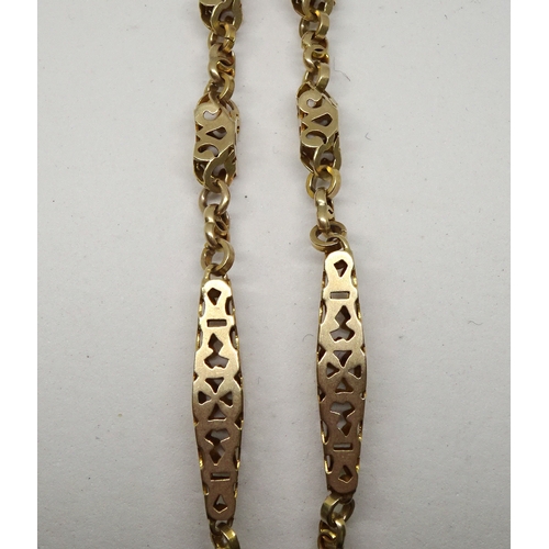 86 - A watch chain of pierced box link design, unmarked yellow metal.  330mm long (by instruction of the ... 