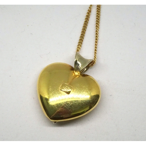 90 - A heart-shaped pendant, yellow metal marked 750, this suspended on a necklace marked 750.  Pendant 3... 