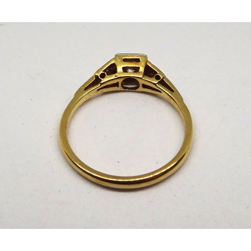 99 - A ring comprising a single brilliant cut white stone set in a square setting with raised, stone set ... 