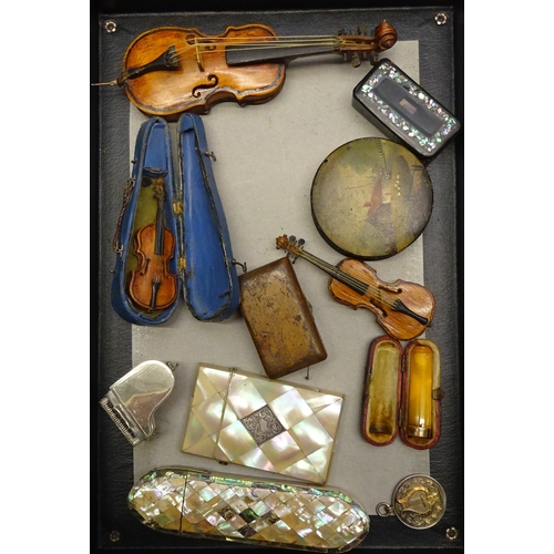 252 - A collectors' lot including a mother of pearl veneered card case; a miniature grand piano, white met... 