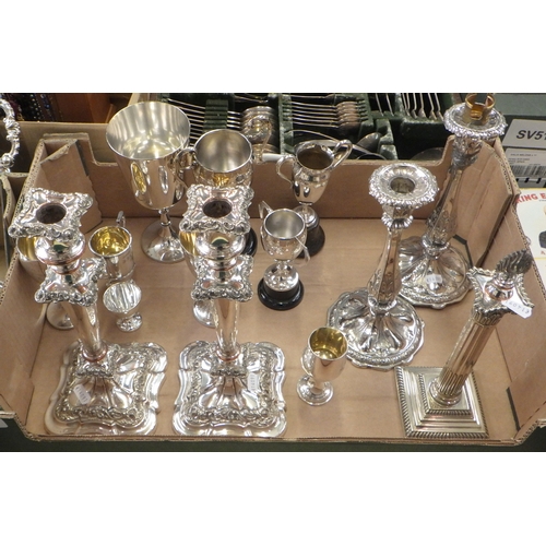 290 - Two pairs of silver plated candlesticks, a single example; silver plated trophy cups (by instruction... 