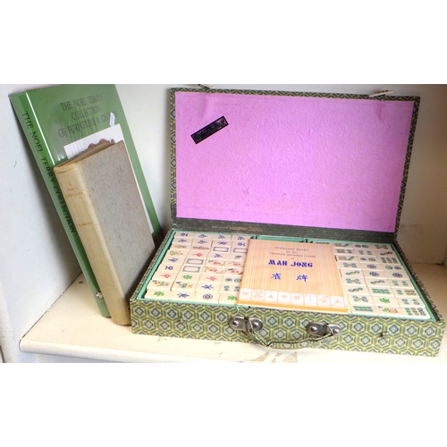 243 - A Mahjong set, a book 