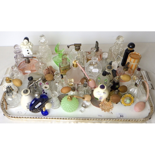 93 - A large and varied collection of atomisers and perfume bottles.