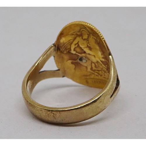 355 - A ring being a George V 1912 half sovereign curved and soldered onto an indistinctly marked yellow m... 