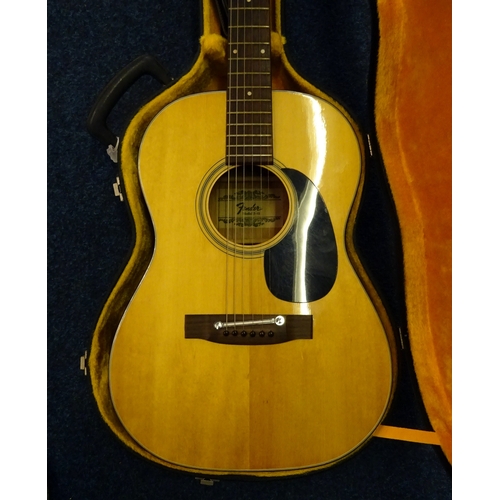 14 - A Fender model F-15 acoustic guitar.