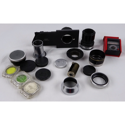 40 - A Leitz Elmar 50mm lens; three various Leitz shoe-mount view finders 21mm / 50mm / 135mm; three Leit... 