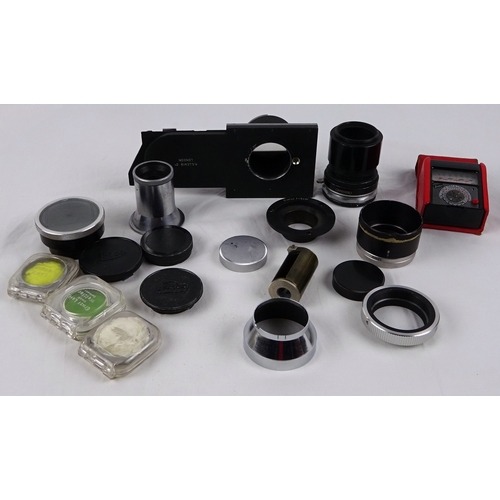 40 - A Leitz Elmar 50mm lens; three various Leitz shoe-mount view finders 21mm / 50mm / 135mm; three Leit... 