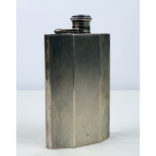 387 - A silver hip flask having engine turned decoration, Birmingham 1946.  135mm tall / 190gr