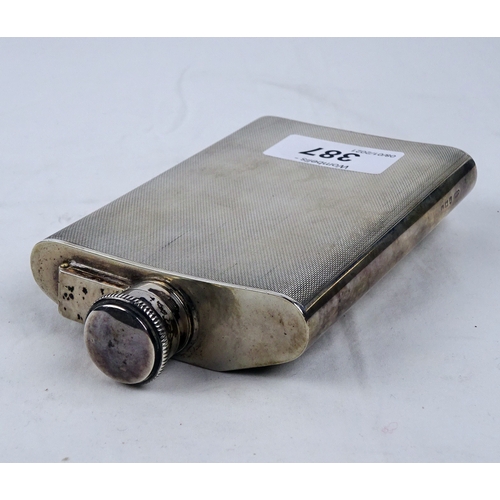 387 - A silver hip flask having engine turned decoration, Birmingham 1946.  135mm tall / 190gr