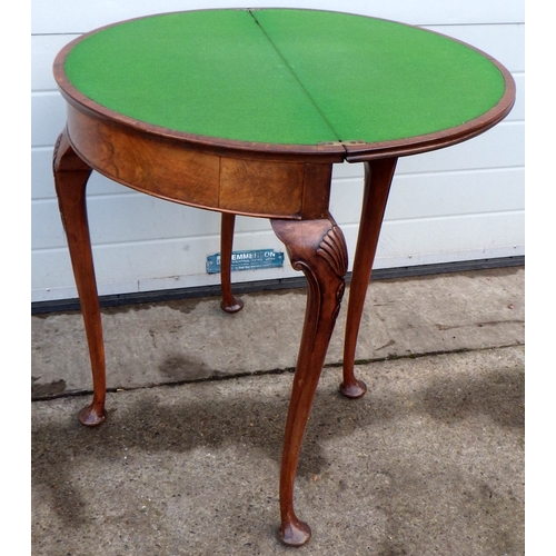 558 - A walnut card table on Queen Anne legs, 76cm wide.