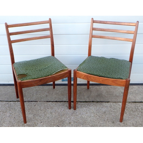 605 - A pair of mid-century dining chairs together with a white Lloyd loom armchair. (3)