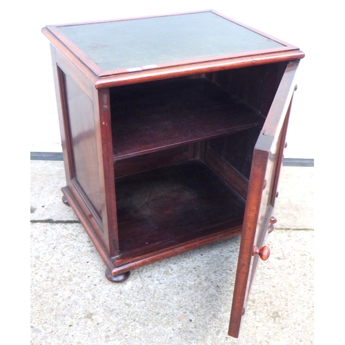 613 - A small Victorian mahogany cupboard  with leather inset top.