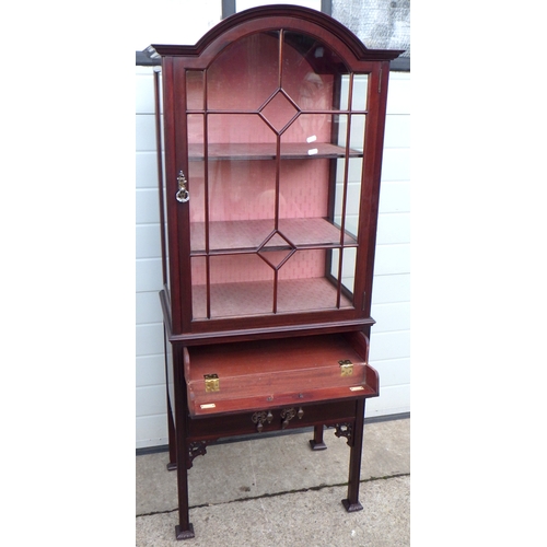 618 - An arch top display cabinet with sheet music dropping drawers, 64cm wide, 153cm tall.