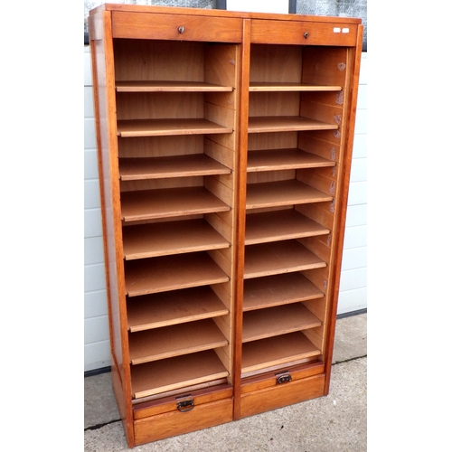 620 - An oak double tambour fronted filing cabinet, 85cm wide, 152cm tall.