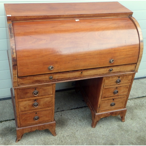 653 - A mahogany cylinder top desk a/f 115cm wide.