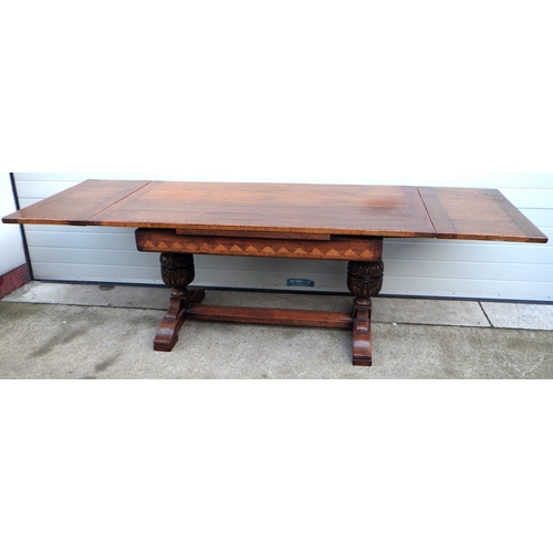 704 - A good quality large oak and inlaid draw leaf table. 170cm long 85cm wide plus 2 x 46cm extensions.