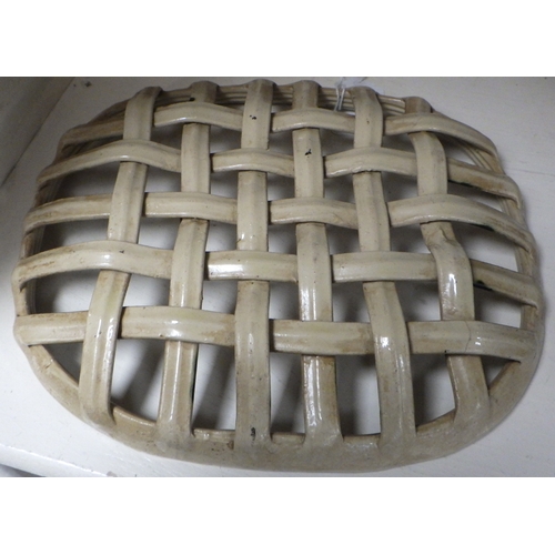 244 - A lattice pottery dish (probably 19thC) 23cm wide.