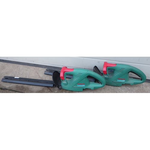 738 - Two Bosch cordless electric hedge cutters