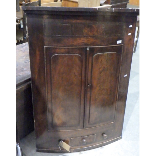 740 - A 19th cen mahogany hanging corner cupboard