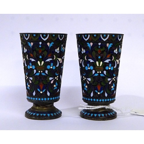 366 - A pair of Russian white metal cloisonné cups, c1900.  Each 79mm tall.  155gr gross