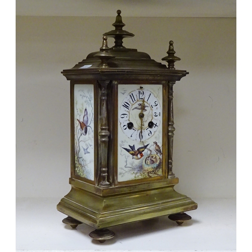 1 - A mantel clock, continental having brass case inset with three bird-in-woodland motif plaques.