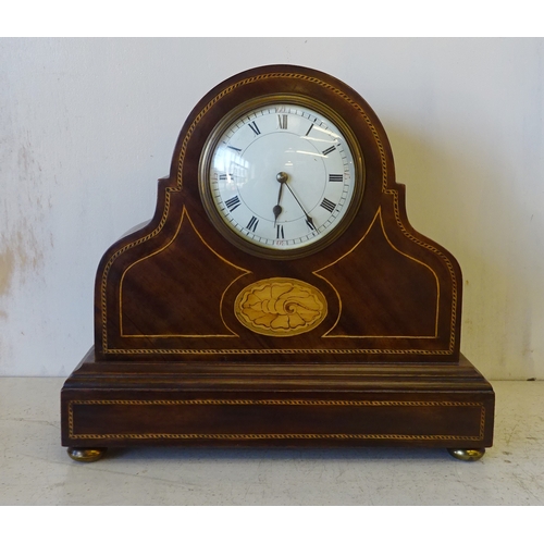 49 - An Edwardian mahogany inlaid mantel clock 26cm wide together with an Edwardian worn Silver plated pe... 