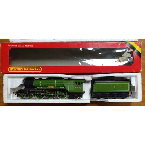 182 - Model railways: a Hornby 00 Gauge Flying Scotsman locomotive; a Hornby Sir Dinadan locomotive.  Both... 